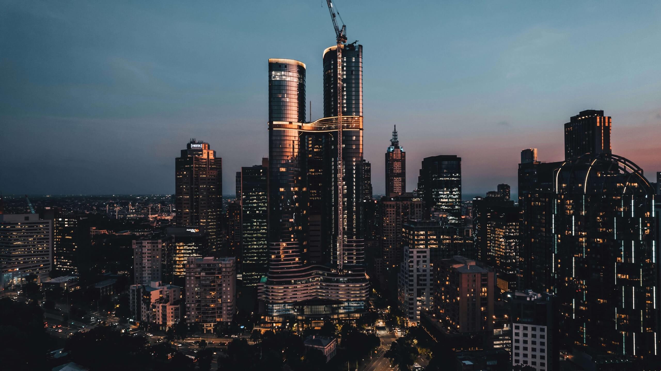 Melbourne towers at night — owners corporation buildings